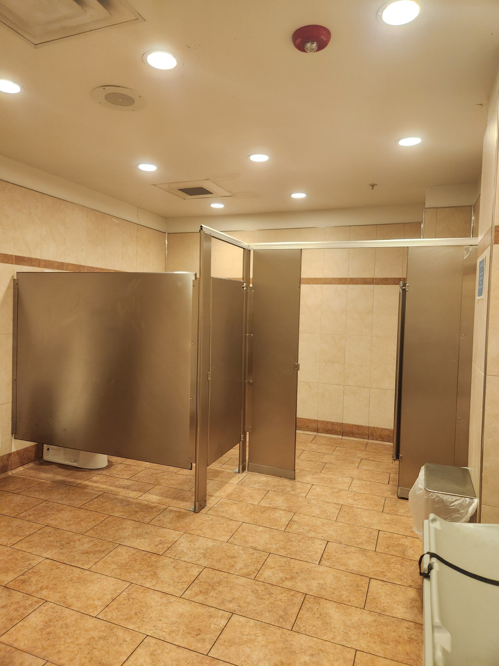 Completed restroom with tile walls and flooring