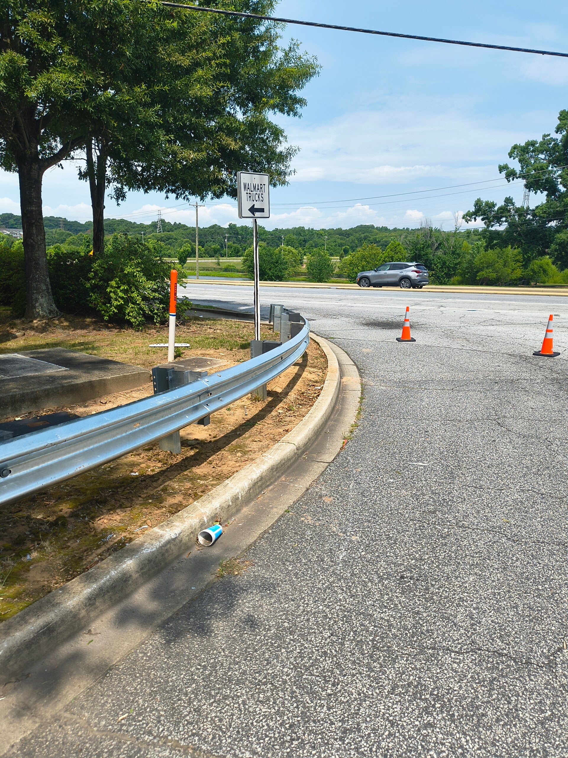 Installed commercial guardrail at a parking lot entrance