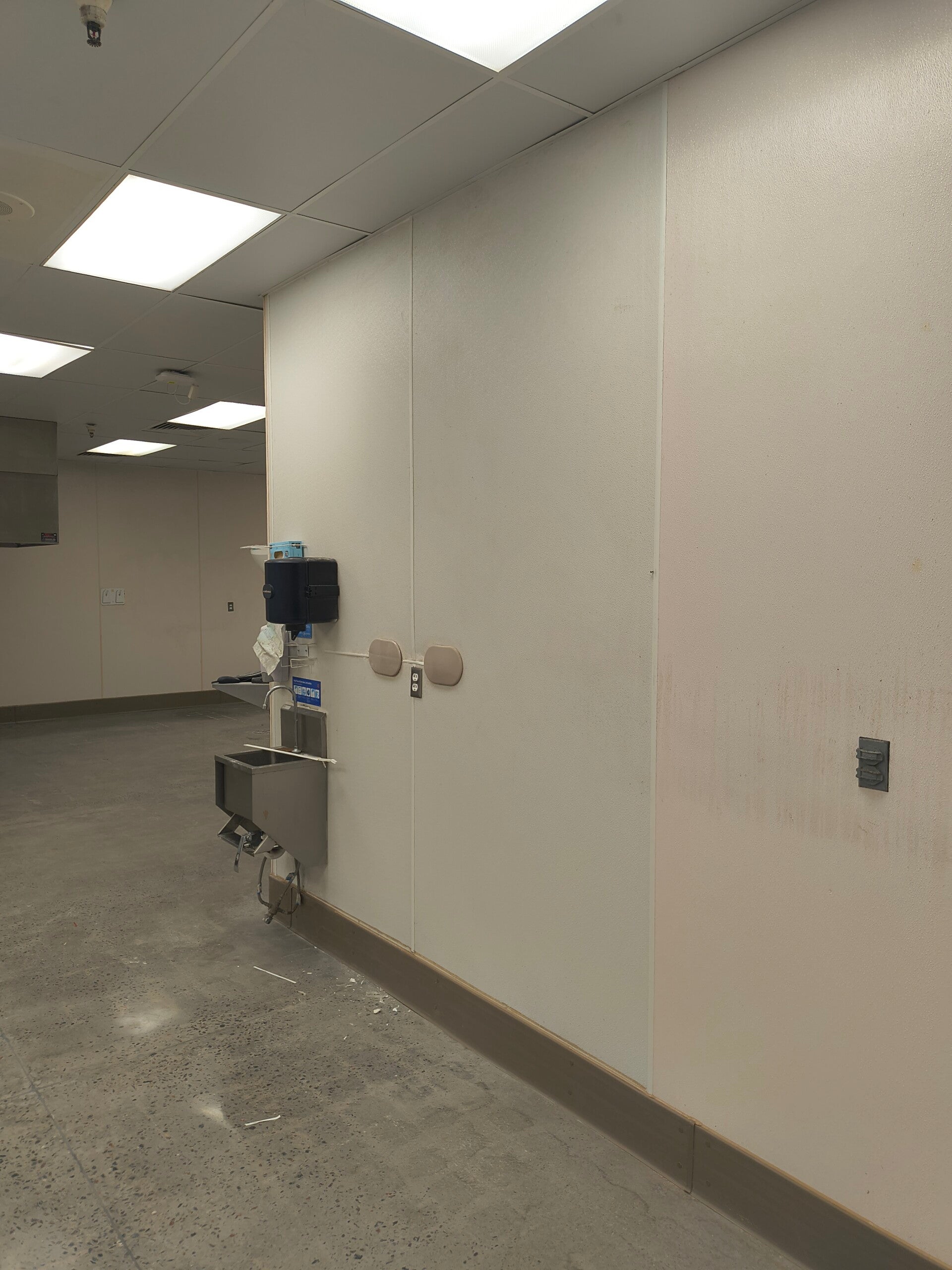 Freshly painted commercial interior wall completed by ATC Services