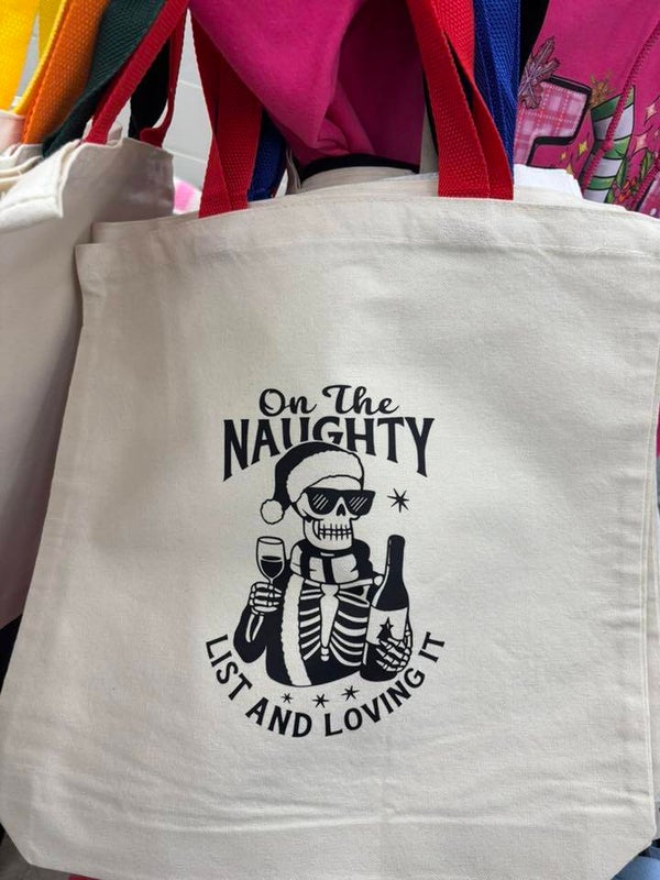 Tote with red handle, On the naughty list and loving it Santa Skeleton