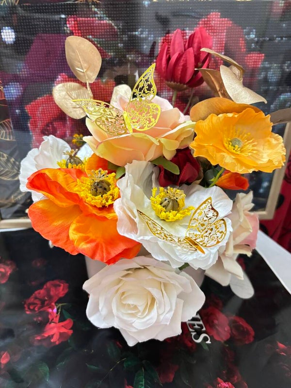 Composition florale pour monument funéraire tons chaud et doré