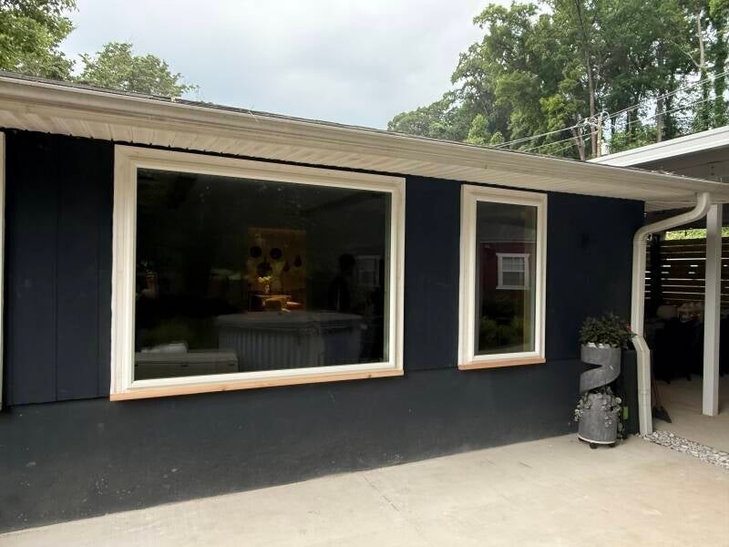Modern home exterior showcasing quality replacement windows