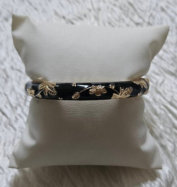 Jonc noir fleuri doré – Élégance intemporelle