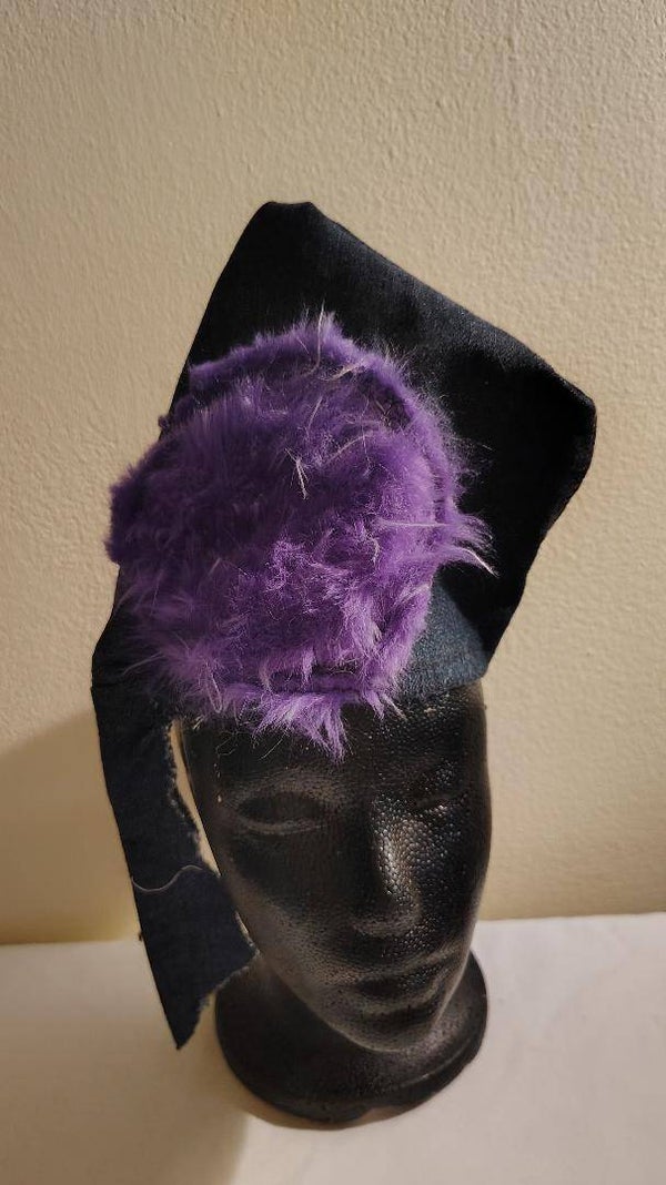 A purple circle unique hat can be worn two ways, for a girl or boy