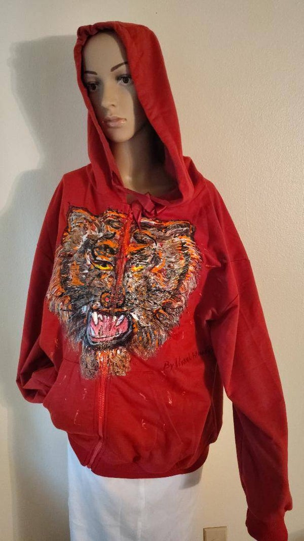 A red hoodie size x large named red tiger, hand painted by an Ohio artist.
