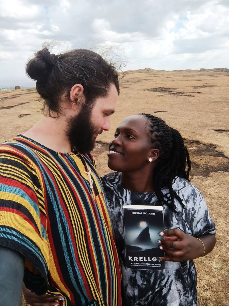 Author Michal Polgar with beloved Linnet in Kenya, holding Krelloy novel together.