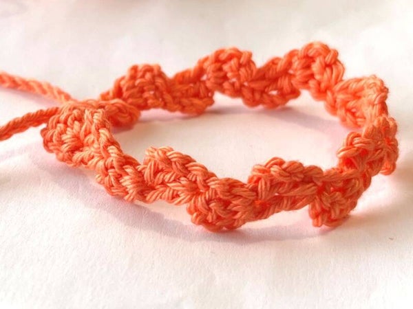 Koraal armbandje Wave
