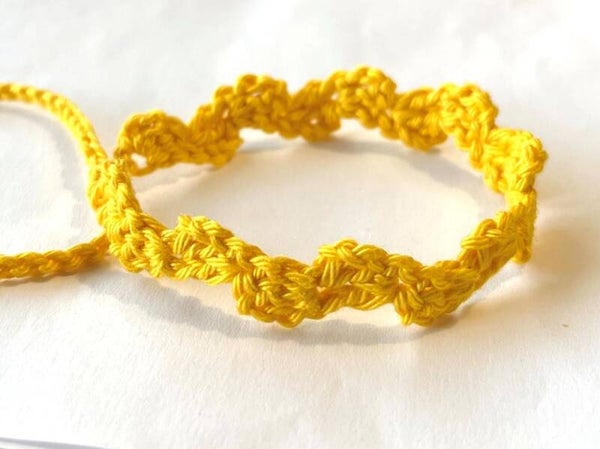 Zonnegeel armbandje Wave