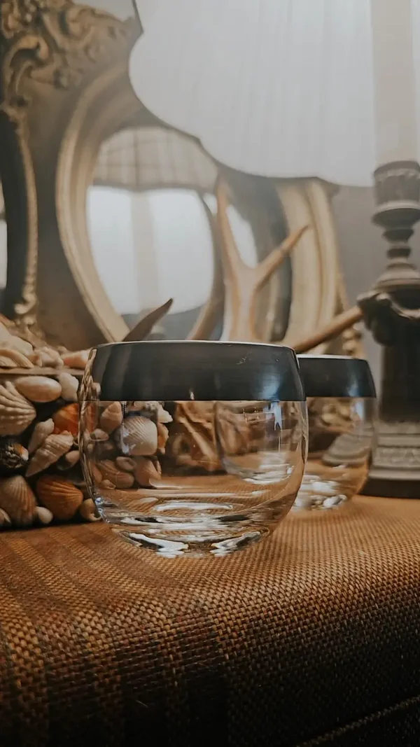 Small vintage candle holder with silver rim.