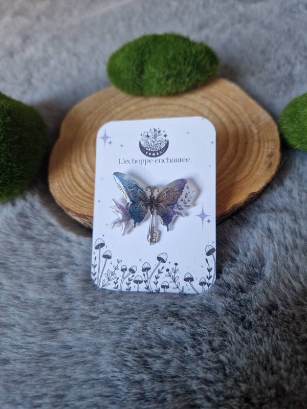 Pin's clé magique volante ailes de papillon,