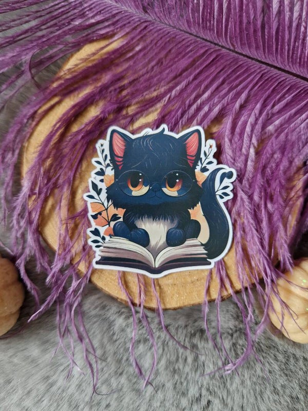 Sticker chat qui lit,