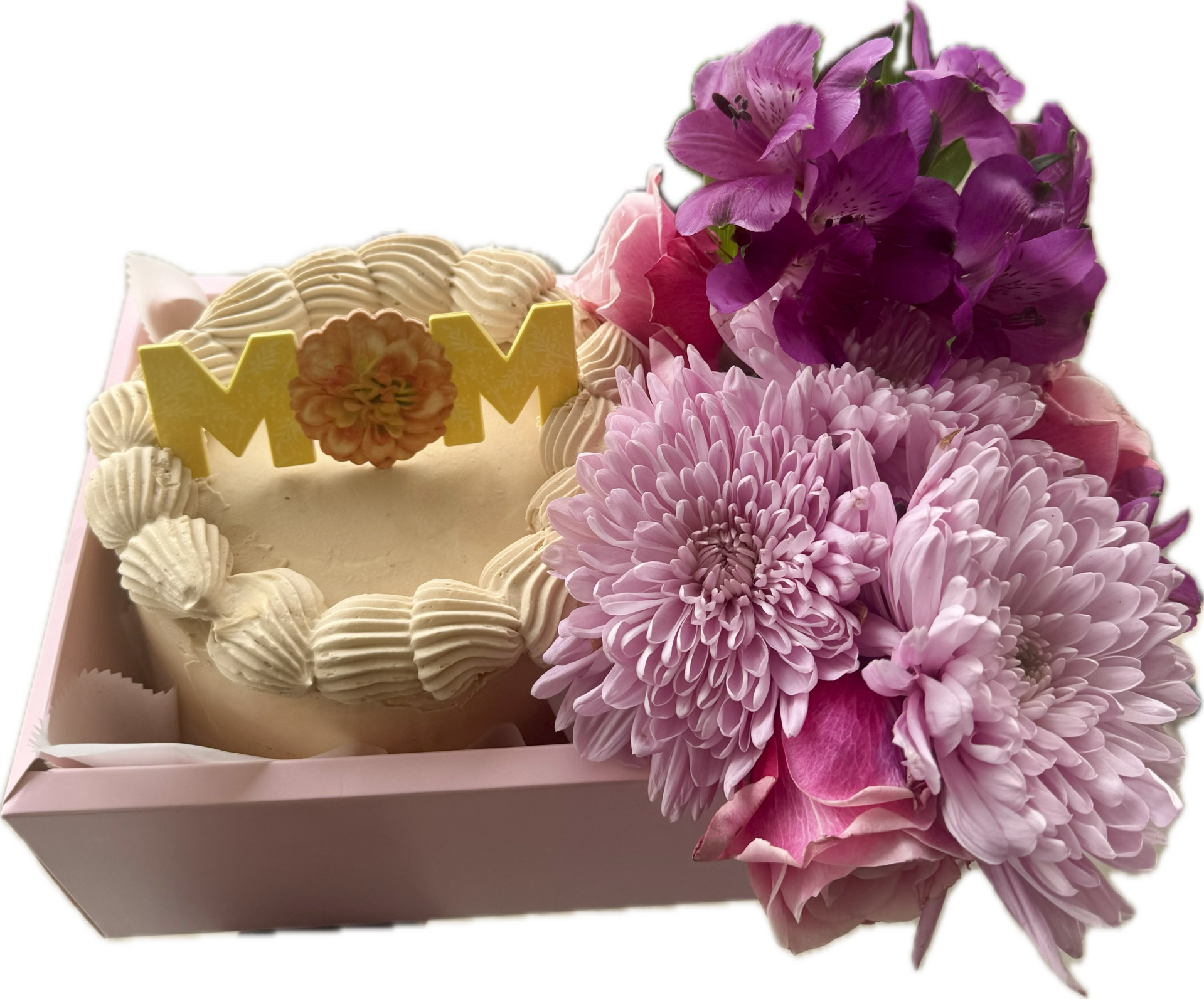 6 inch yellow cake with shell border and yellow topper that says "mom" in a box next to pink and purple flowers