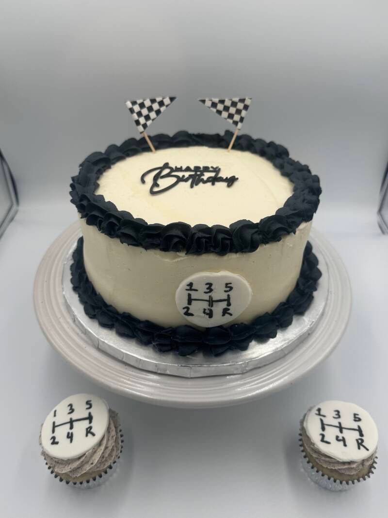 white and black racecar themed cake and cupcakes