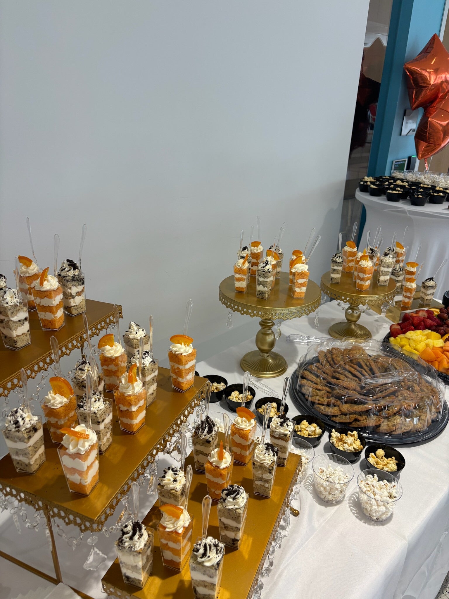 oreo and orange creamsicle cake shooters and and platter of chocolate chip cookies