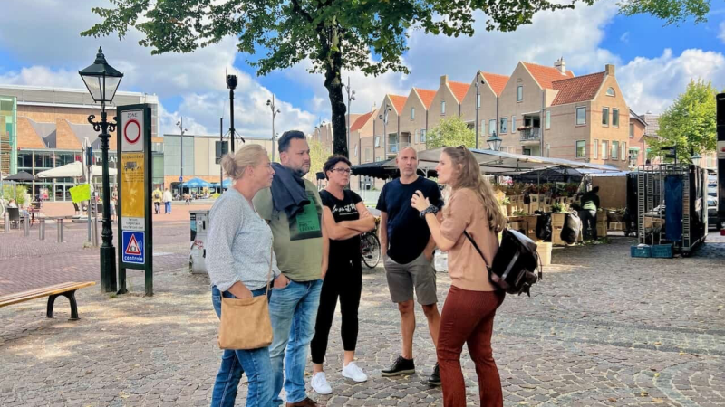 Visitors exploring Alkmaar's historic city center on foot