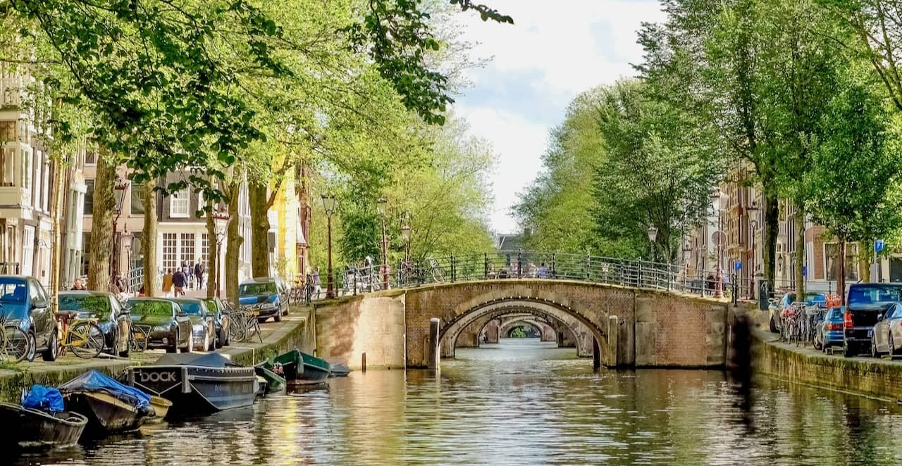 Walking tour in Amsterdam with a local guide along the canals and historic streets.