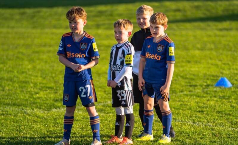 "Small group of children training together at DJR football coaching"