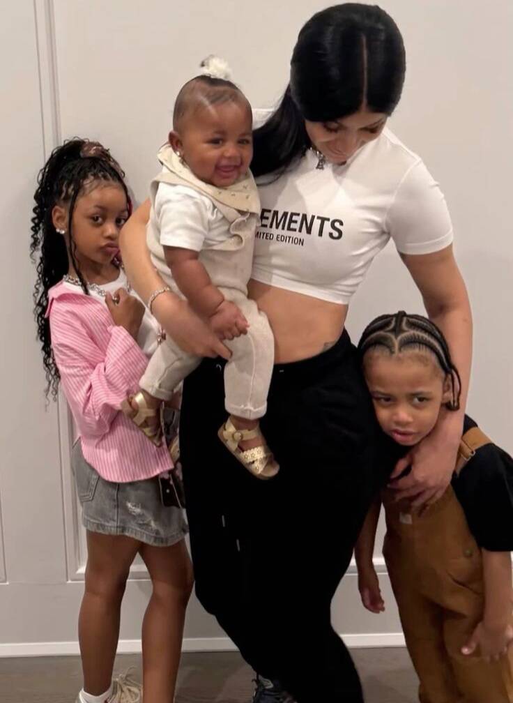 Cardi B at home posing with her kids–Kulture, Wave and Blossom.
