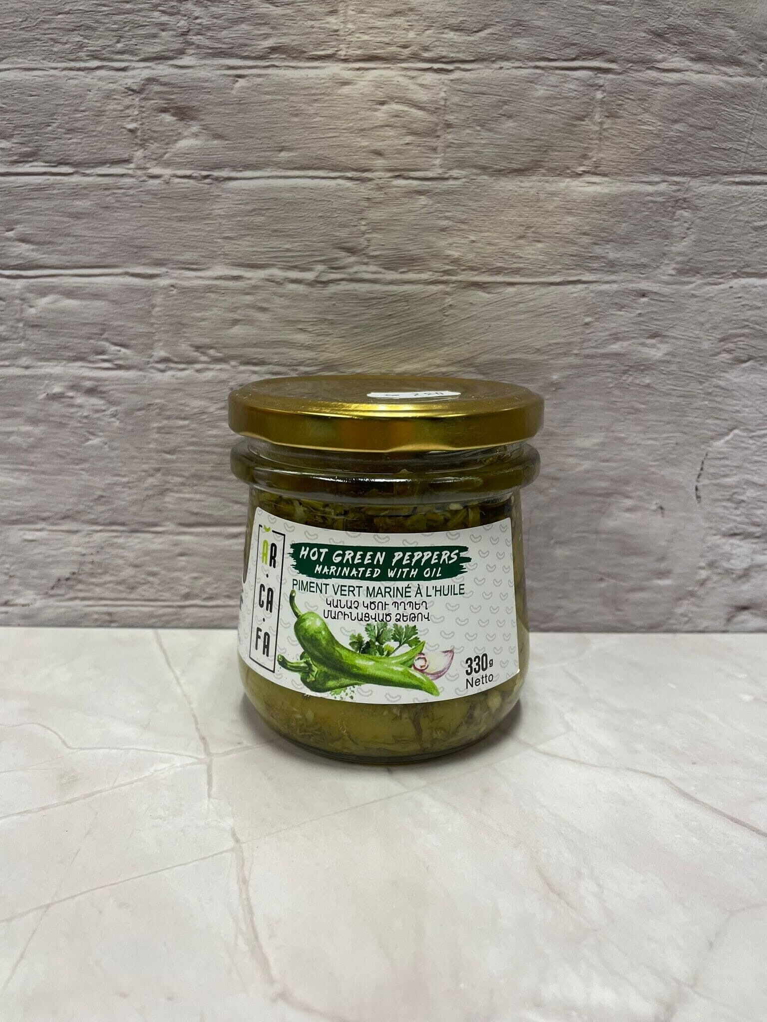 Gemarineerde groene pikante pepers in olie Մարինացված կանաչ կծու պղպեղ ձեթով Маринованные острые зеленые перцы в масле 300cl