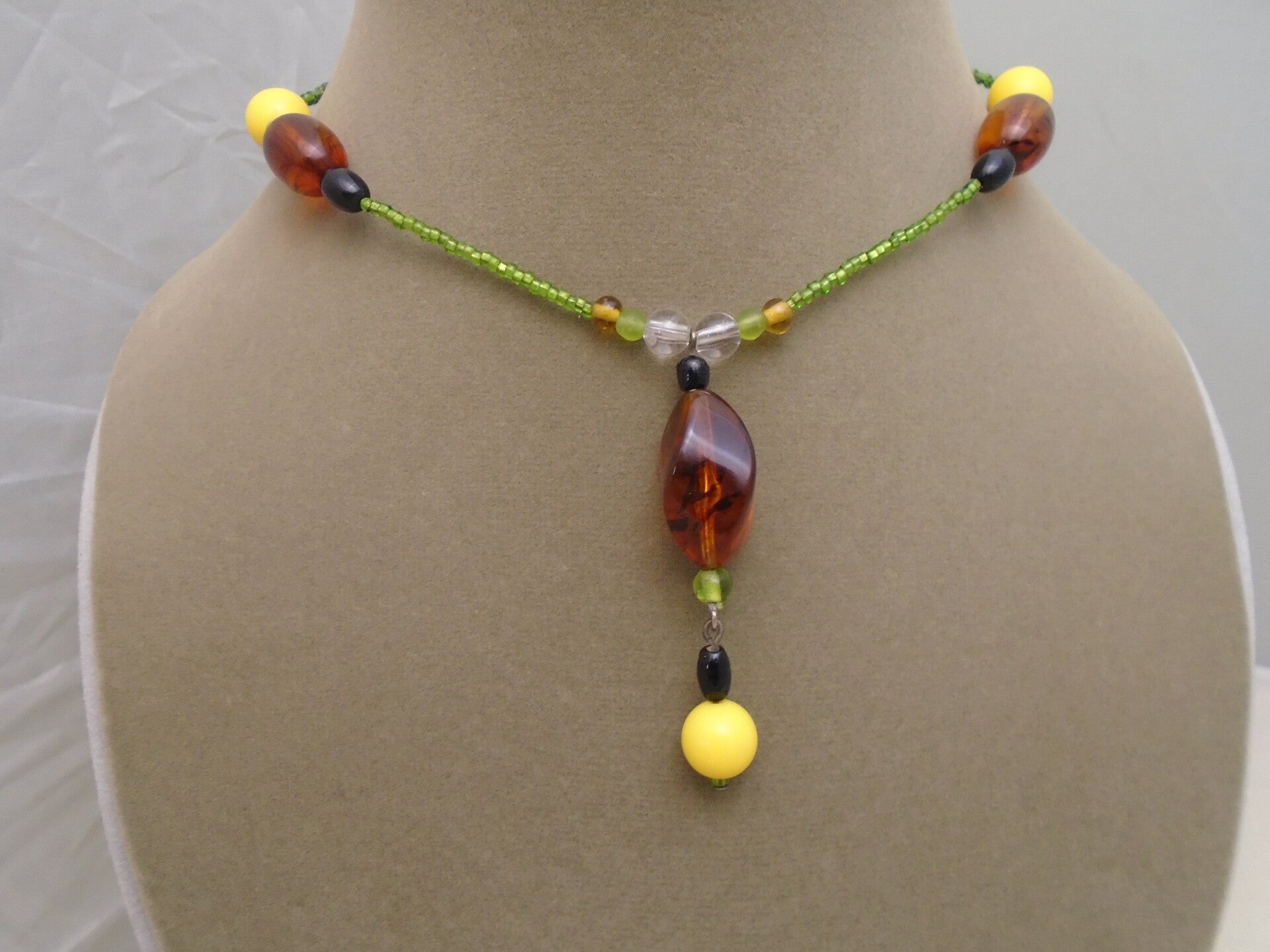 Brown, yellow & green plastic necklace