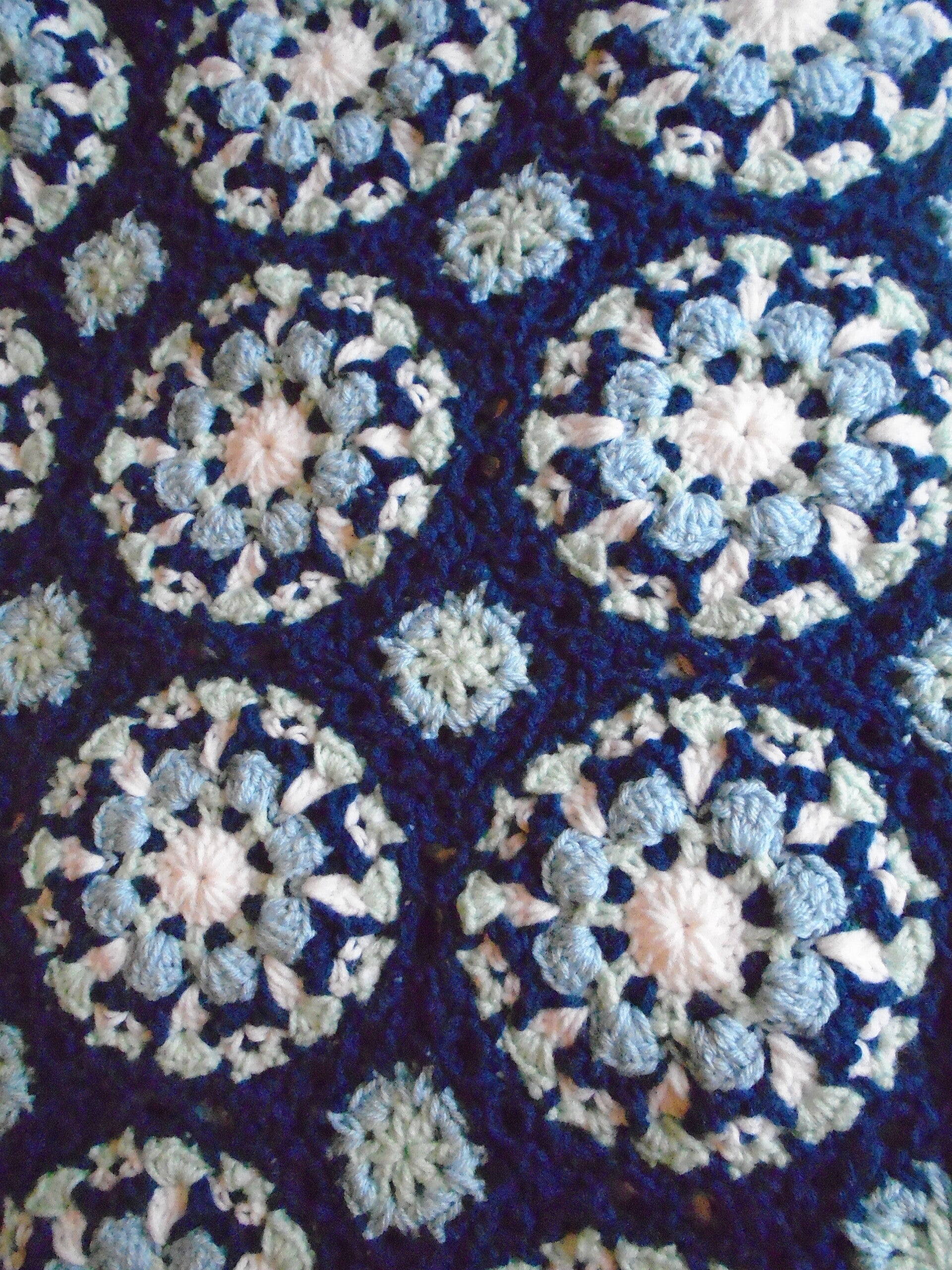 Crocheted floral tile afghan