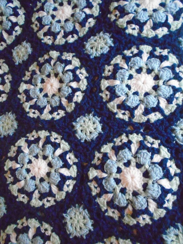 Crocheted floral tile afghan