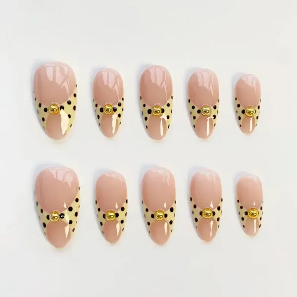 yellow and brown poka dot nails