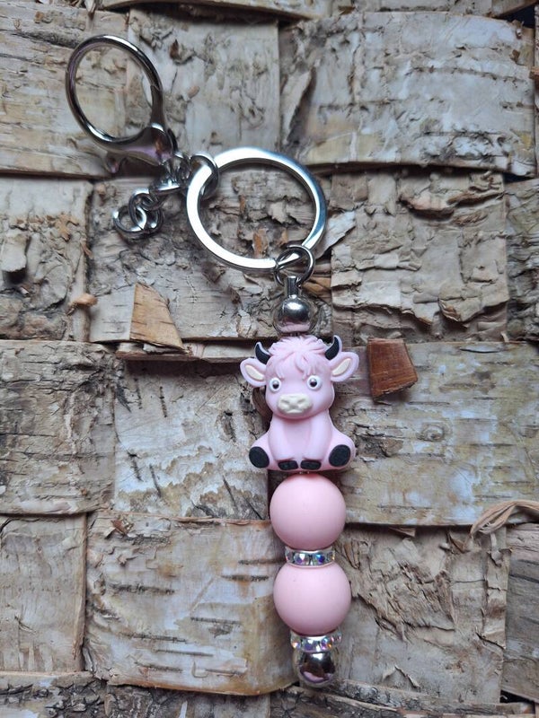Süßer Schlüsselanhänger mit einer pinken Kuh, Taschenanhänger mit Silikonperlen, Geschenkidee