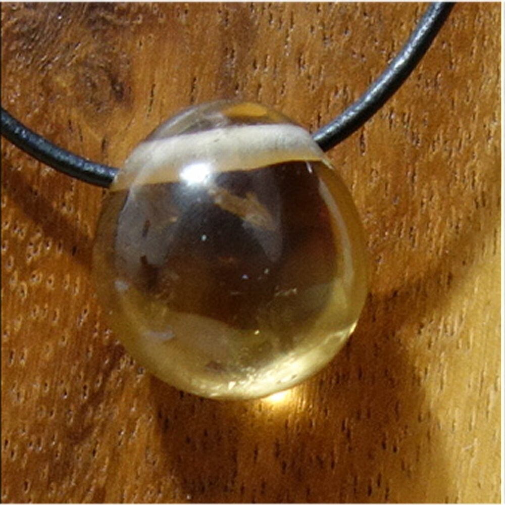 Citrin gebohrt mit 80 cm Band & Jutesäckchen