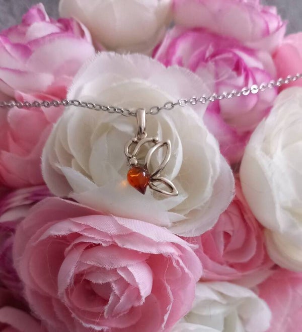 Pendentif ambre papillon