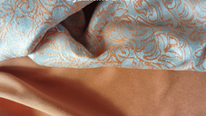 Byzantine Ember, silver brocade with burnt orange pattern and plain burnt orange soft fabric.
