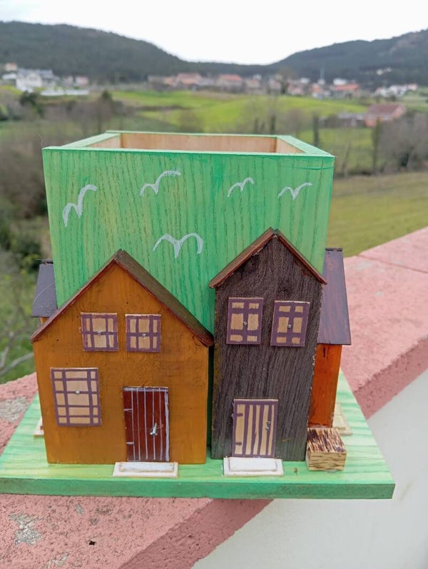 Lapicero con casas verde