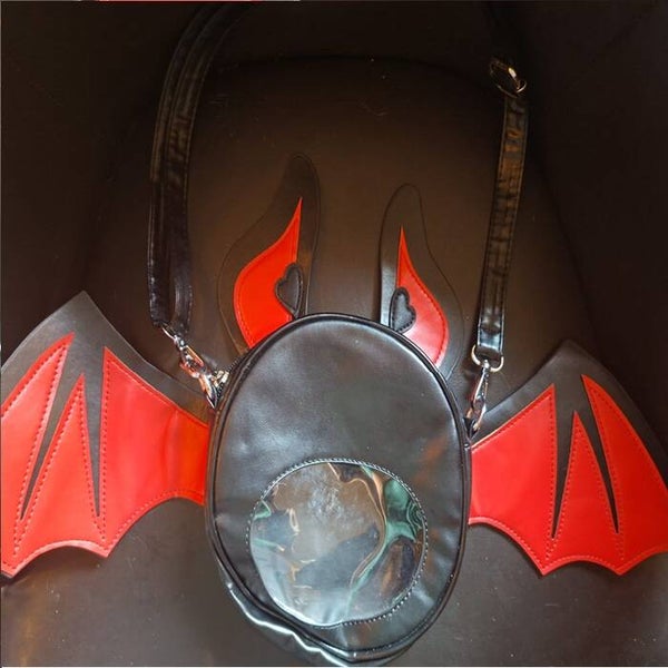 schattige handtas vleermuis, rood,
