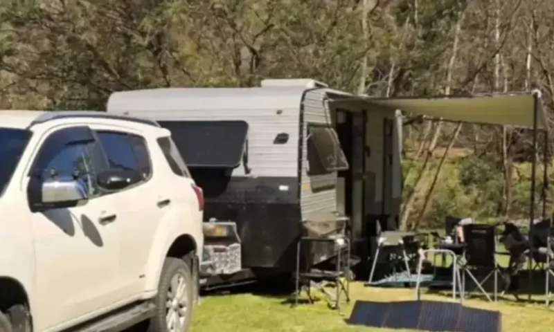 caravan and vehicle set up at Macalister River region caravan park in Gippsland.