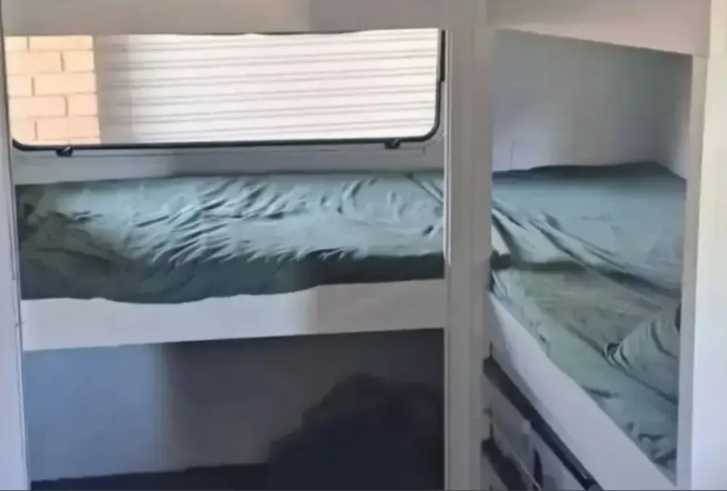custom bunk bed configuration inside a 21ft caravan for a family of five.