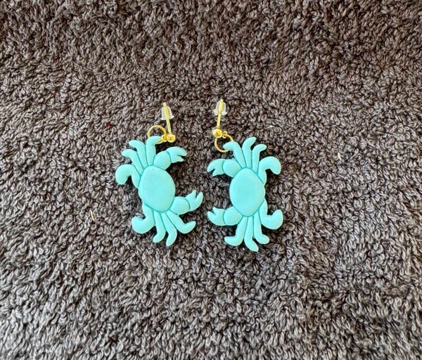 Boucles d’oreilles Crabes bleu.