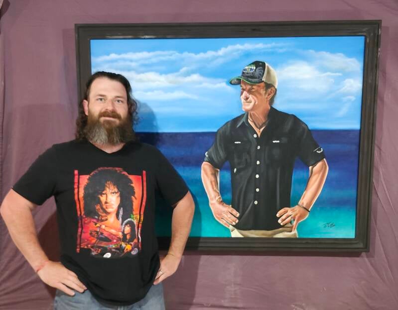 Artist with Jeff Probst painting 