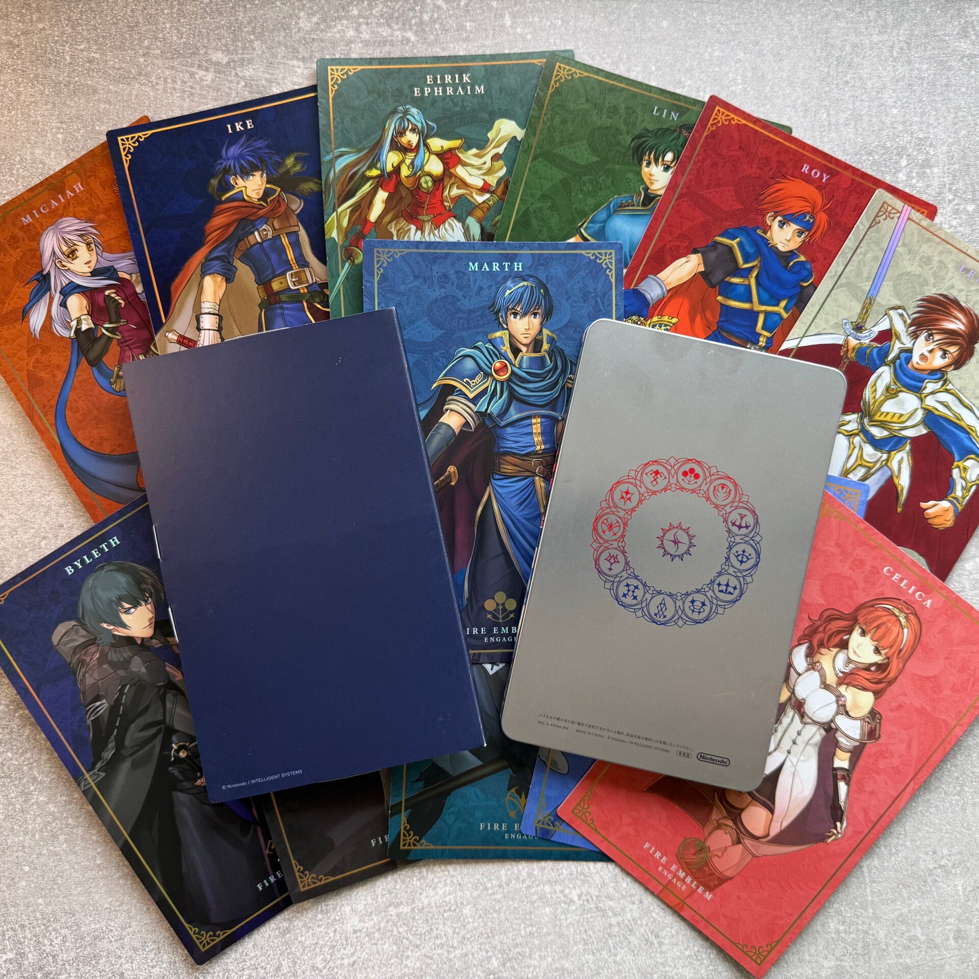 Fire Emblem Engage – Elyos Collection Steelbook & 12 Emblem Art