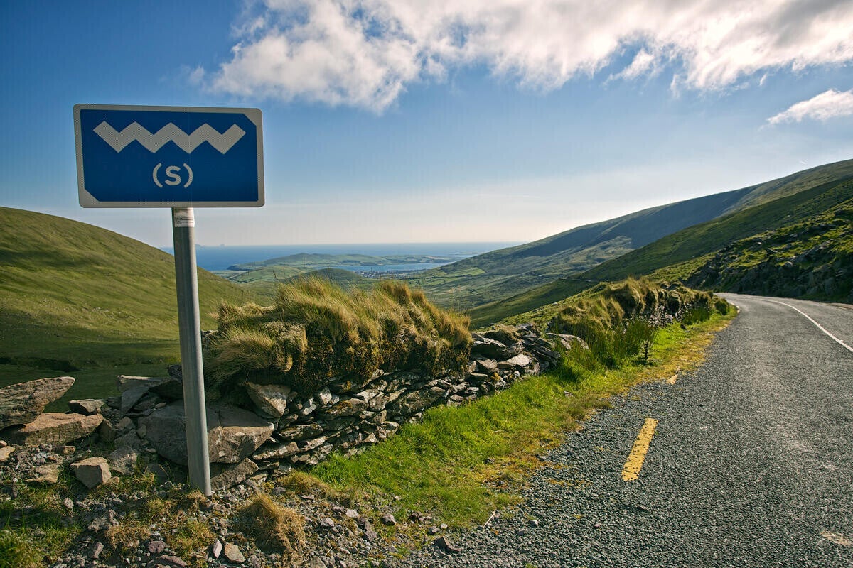 A photo of Conor Pass, the mountains and road.
