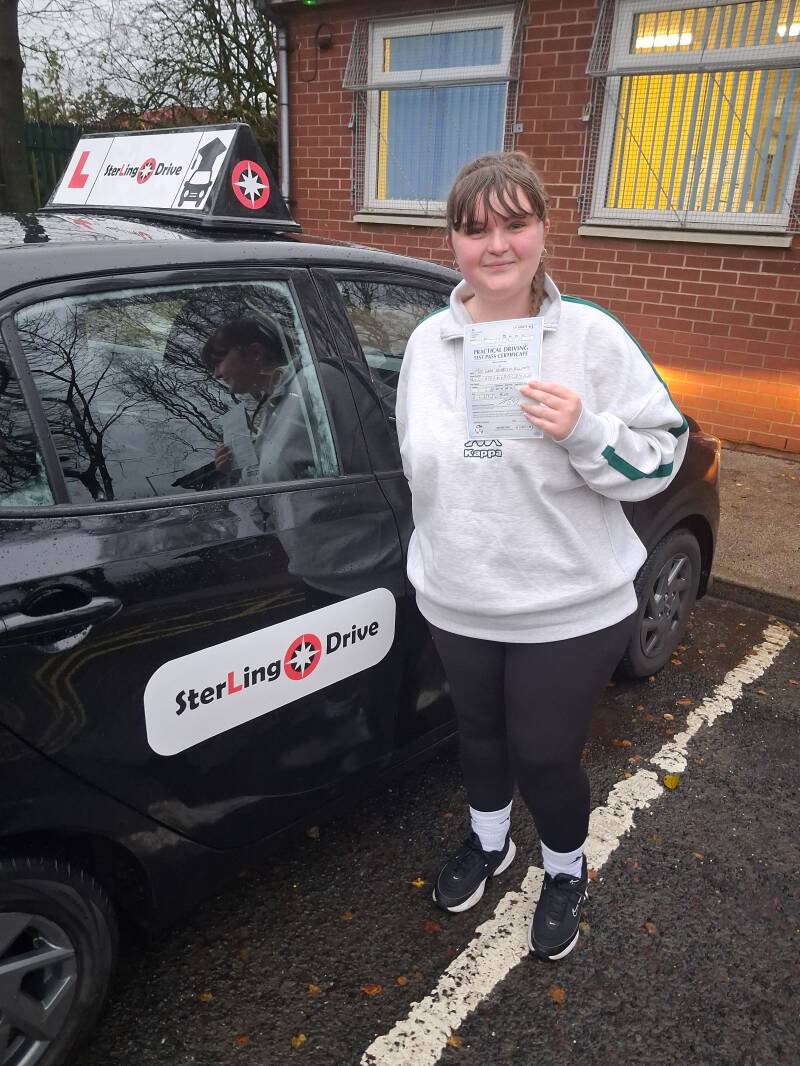 Sterling Drive learner driver holding pass certificate outside test centre