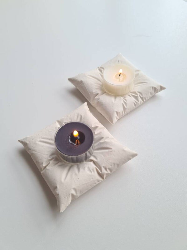 Tea light holder pillow including tea light