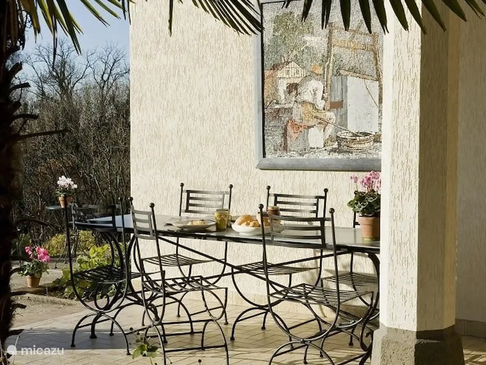 Het vakantiehuis en de tuin