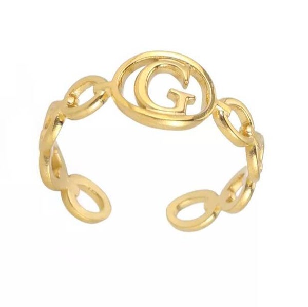Bague fantaisie ajustable "G" dorée