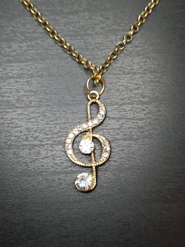 Collier fantaisie "Clé de sol" diamant doré