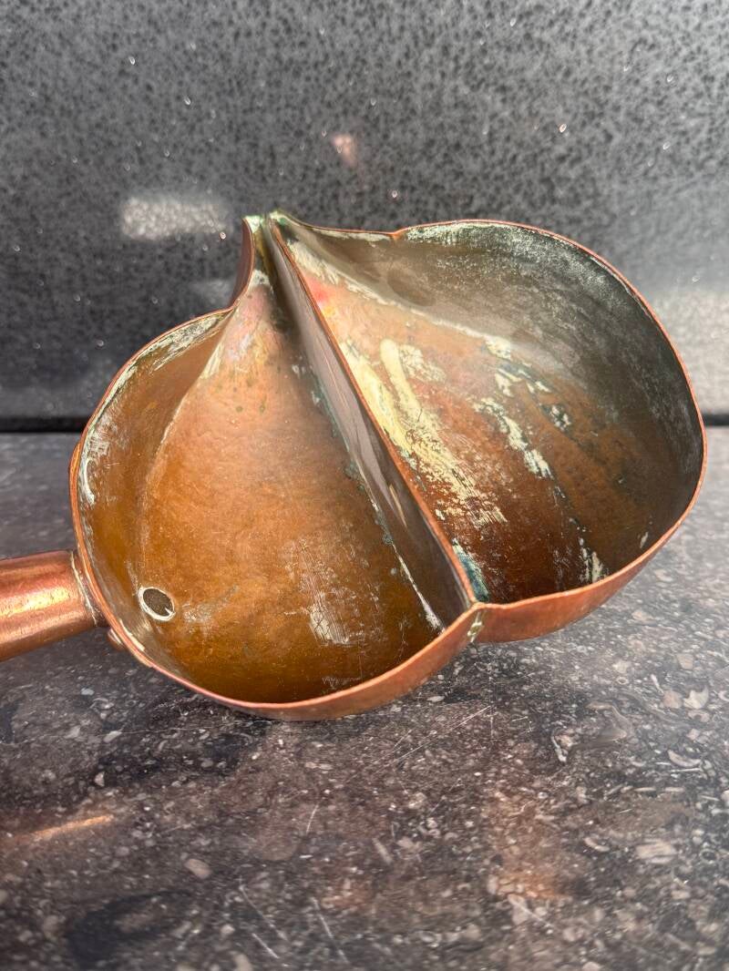 Interior view of antique French copper measuring scoop 
