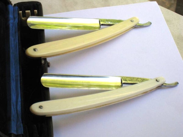 Klassiek gebruikte Rebell 4/8 solingen scheermes in leder etui