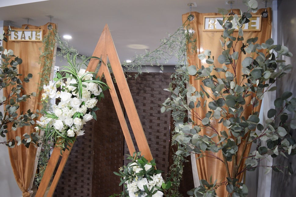 Bride and groom celebrating with a toast and photography at the Pop-Up Wedding Event hosted by One Love Ceremonies & Saje Rose.