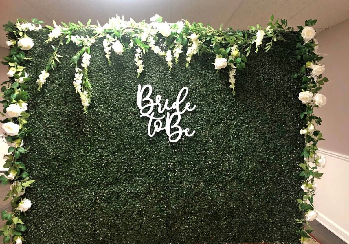 Grass wall backdrop rental for weddings and event photo opportunities