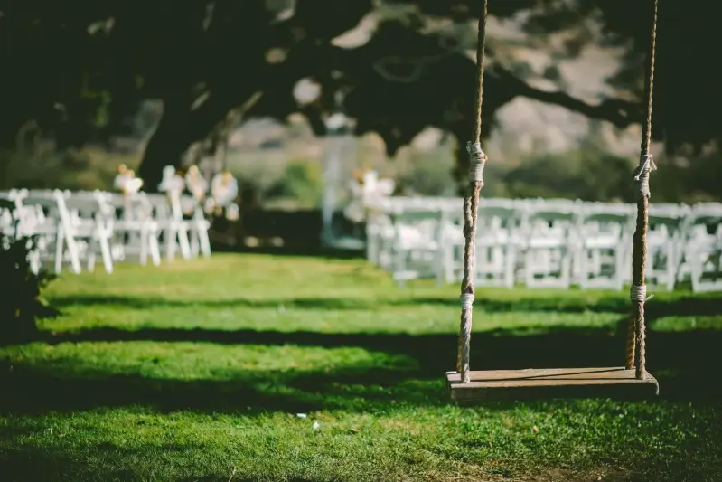 Scenic Hudson Valley wedding ceremony setup with arch and chairs outdoors