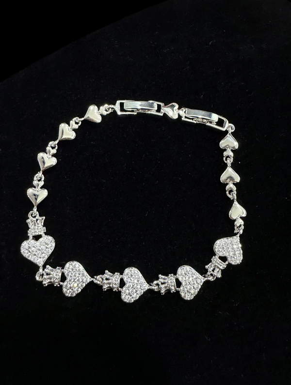 0143 Bracelet - Silver tone bracelet with 5 pave hearts